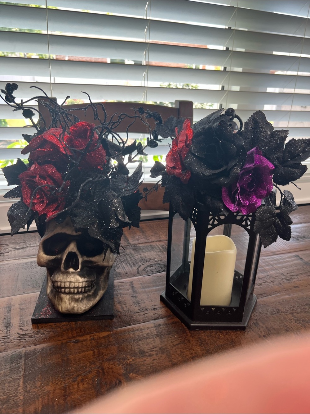 Skull Vase with Red, Black and Purple Glitter Roses, candy bag and Rae Dunn mat.